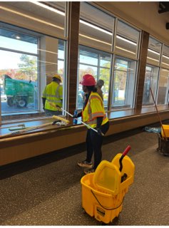 Crew mopping a retail store floor